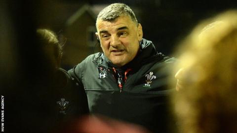 Rowland Phillips speaks to his team