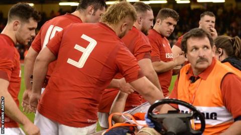 Ellis Jenkins is consoled by his Wales team-mates