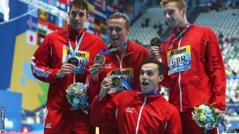 Gold medallists Dan Wallace, Robert Renwick, Calum Jarvis and James Guy of Great Britain pose during the medal ceremony for the Men's 4x200m Freestyle Relay at the World Championships