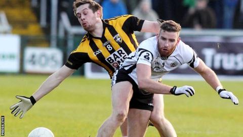 Crossmaglen's Johnny Hanratty challenges Kilcoo's Paul Greenan in the 2013 Ulster Club quarter-final replay