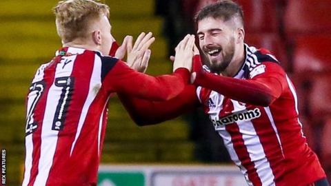 Kieron Freeman celebrates Sheffield United's second goal against Millwall