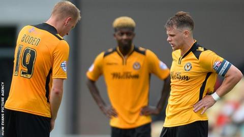 Newport players looked dejected after conceding a third against Leyton Orient