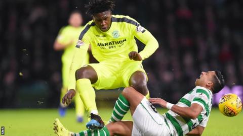 Hibs' Darnell Johnson fouls Celtic's Emilio Izaguirre, who was taken off injured