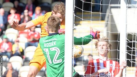 Ryan Bird bundles-in the ball for Newport County against Accrington Stanley