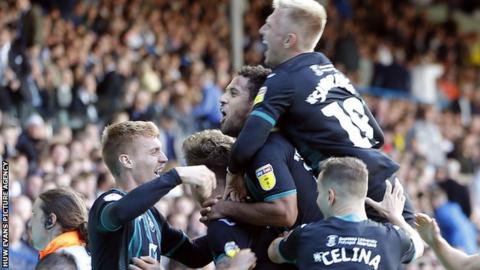 Swansea players celebrate Wayne Routledge's late goal at Leeds