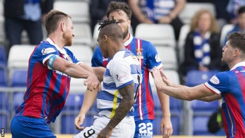Morton's Jai Quitongo (R) clashes with Inverness CT's Gary Warren during the match.