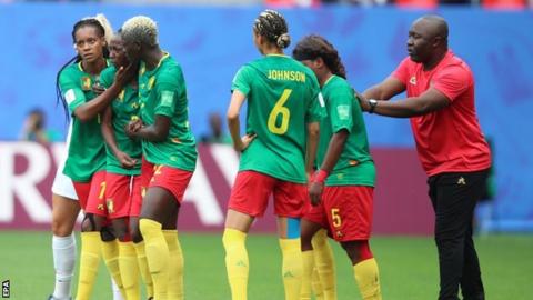 Cameroon coach Alain Djeumfa (right) encourages his team to continue after Ajara Nchout's goal was ruled out for offside