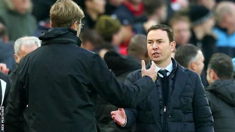 Jurgen Klopp and Derek Adams