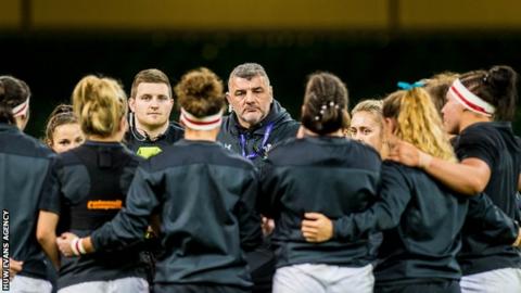 Rowland Phillips in huddle with Wales women