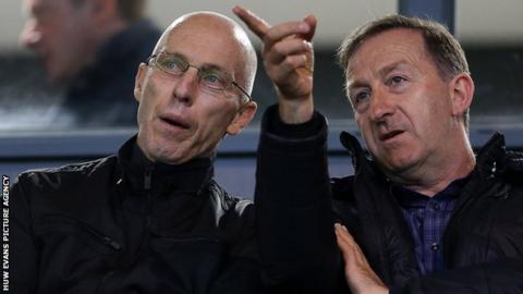 Huw Jenkins makes a point to Swansea manager Bob Bradley