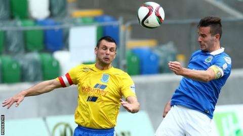 Ballymena's Jim Ervin battles with Andrew Waterworth on the opening day of the Premiership season in August