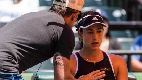 Garbine Muguruza and coach Sam Sumyk on court at the Miami Open