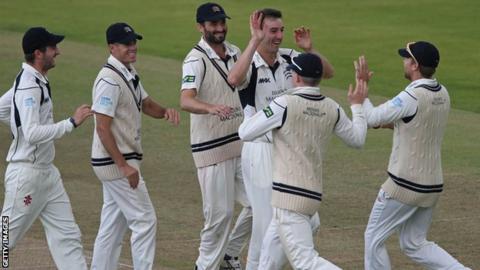 Toby Roland-Jones celebrates a wicket with Middlesex team-mates