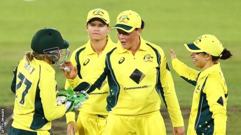 Grace Harris (centre) is congratulated