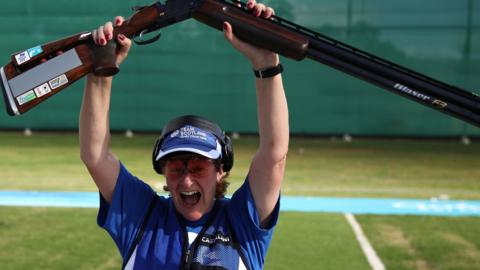 Linda Pearson celebrates her bronze medal