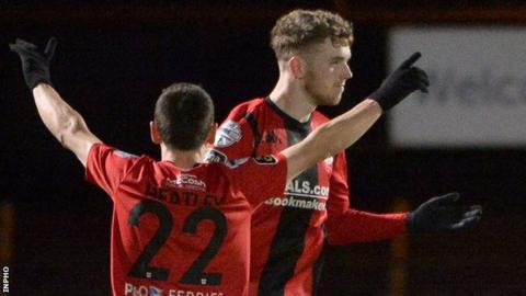 Jamie McGonigle celebrates his goal with Crusaders team-mate Paul Heatley