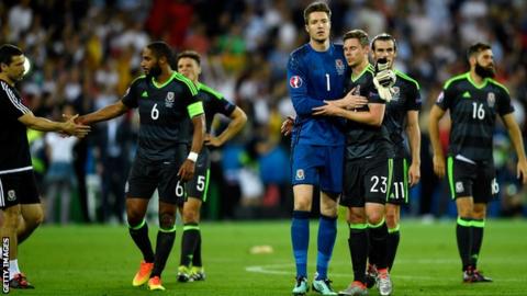 Simon Church is consoled by Wayne Hennessey after his last Wales appearance in the semi-final of the Euro 2016