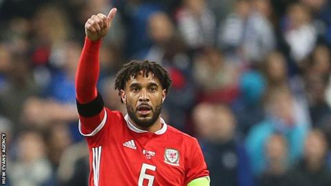 Ashley Williams acknowledges a team-mate