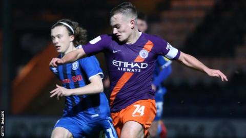 Manchester City Under-21 captain Luke Bolton in action against Rochdale