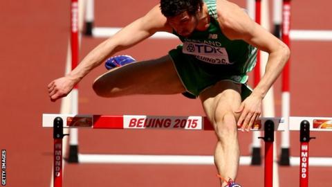 Ben Reynolds clears a hurdle in his World Championships heat