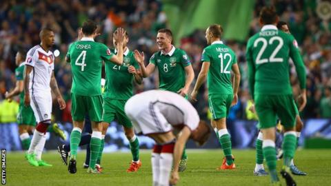 Republic of Ireland players celebrate scoring against Germany