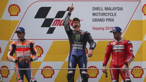 Maverick Vinales (centre) on the podium with Marc Marquez (left) and Andrea Dovizioso after the Malaysian Grand Prix