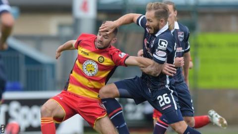 Martin Woods (right) closes down Partick's Sean Welsh during the Scottish Premiership clash