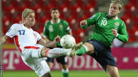 A Czech Republic player tackles NI's Grant McCann in the 2010 World Cup qualifier in Prague