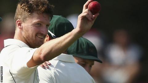 Australia's Jackson Bird raises the ball after finishing with five wickets against New Zealand