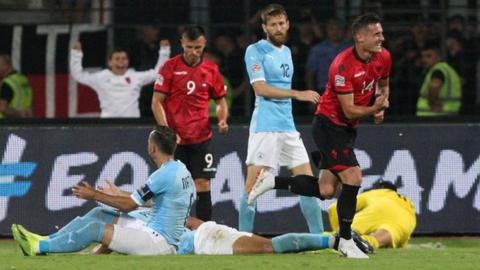 Taulant Xhaka (right) celebrates the goal that earned Albania a win over Israel