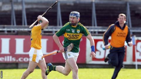 John Egan after hitting Kerry's winning point in the relegation play-off in April as Antrim's Odhran McFadden shows his dejection