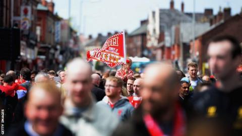 Fans walk to game at Anfield