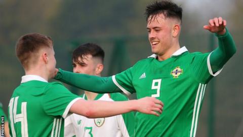 Northern Ireland's Callum Ferris celebrates after scoring
