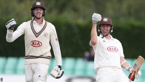 Morne Morkel and Rikki Clarke walk off after guiding Surrey to victory against Worcestershire