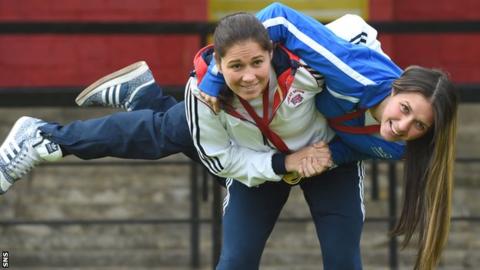 Louise Renicks holds her younger sister Kimberley aloft