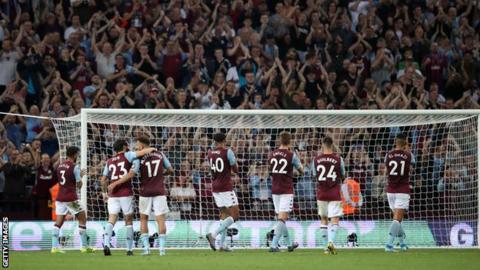 Aston Villa players celebrate with the home fans