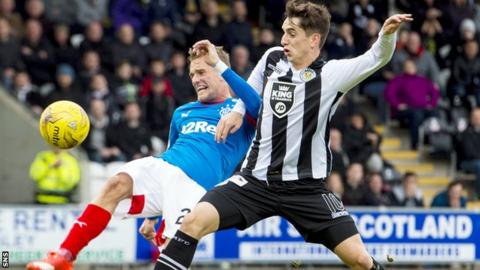 Rangers' Dean Shiels is tackled by St Mirren's Stuart Carswell
