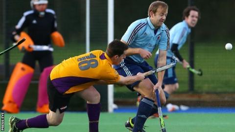 Belfast Harlequins's Christopher Lemon tries to block a Alan Patterson shot