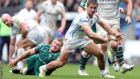 London Irish lock Franco van der Merwe tries to tackle Exeter winger Santiago Cordero