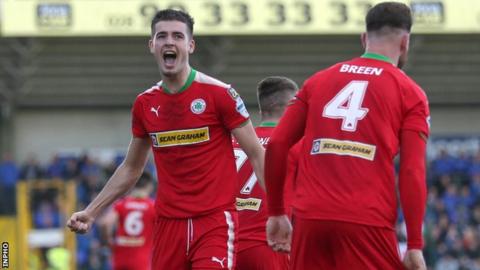 Jay Donnelly scored one of Cliftonville's three goals in the last 10 minutes to beat Linfield 3-2 on 30 September