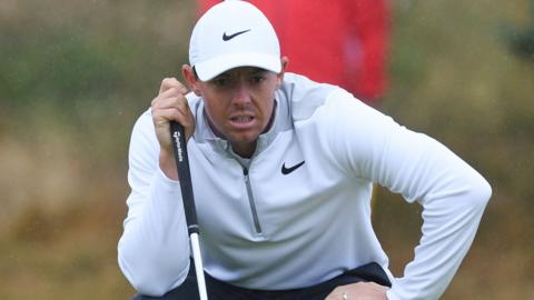 Rory McIlroy surveys a green at Carnoustie