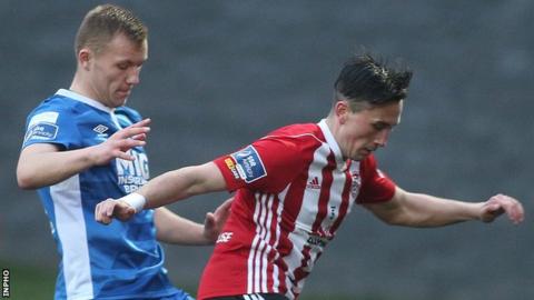Aaron McEneff is challenged by Jamie Lennon at the Brandywell