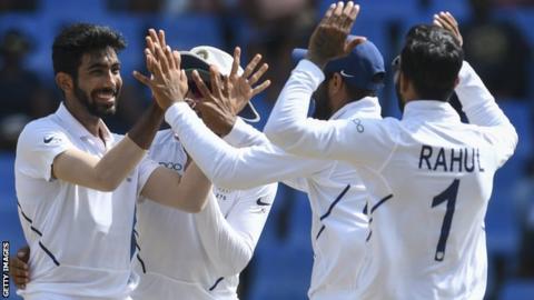 Jasprit Bumrah (left) celebrates with his India team-mates