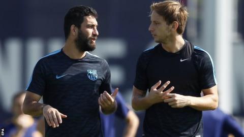 Arda Turan with Barca team-mate Ivan Rakitic