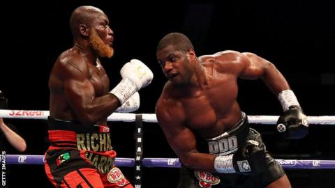 British heavyweight Daniel Dubois (right) lands a blow against Ghana's Richard Lartey (left)