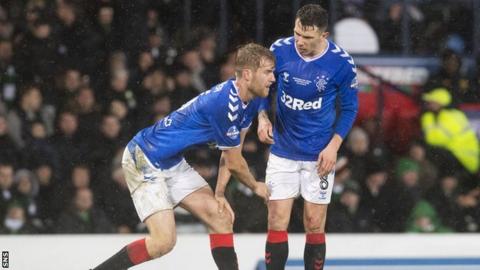 Rangers centre-half Filip Helander (left) is in pain against Celtic