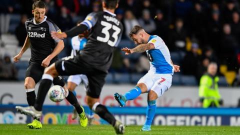 Blackburn's Adam Armstrong scores against Derby