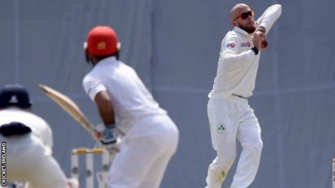 Spinner James Cameron-Dow in action on day two against Afghanistan