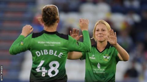 Claire Nicholas celebrates taking a wicket
