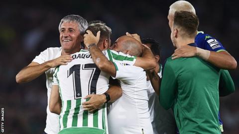 Quique Setien celebrates beating Sevilla with his Real Betis players